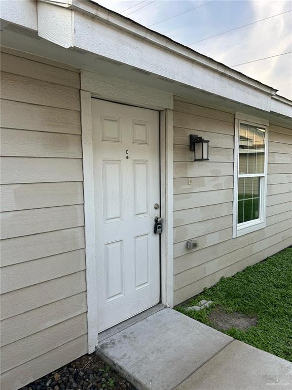 a view of house with backyard