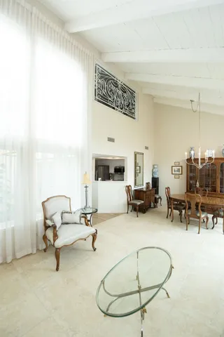 a view of a livingroom with furniture and a window