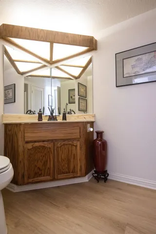a bathroom with a sink a vanity and a mirror