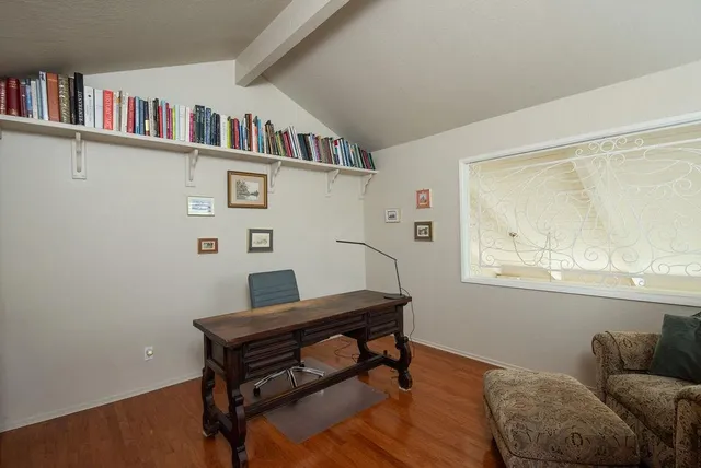 a room with furniture and a book shelf