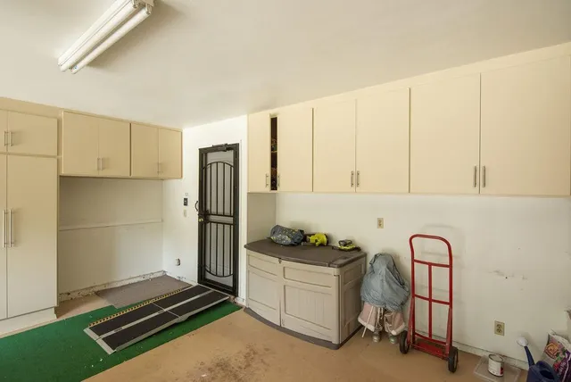 a view of a street with a trees in the background