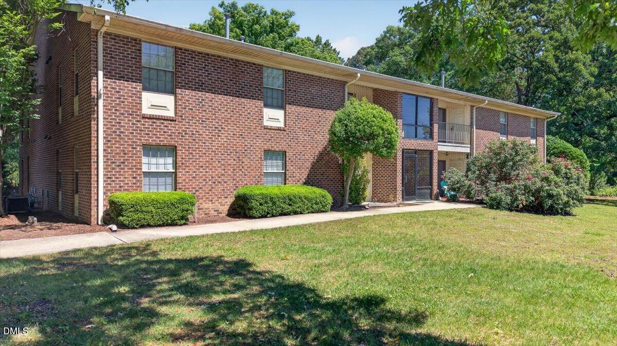 1630 Oxford Road, Unit B Henderson, NC 27536 - Photo 1 of 30 a view of a brick house with a yard