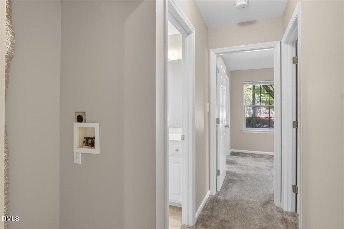 1630 Oxford Road, Unit B Henderson, NC 27536 - Photo 11 of 30 a view of a hallway with wooden floor and a livingroom