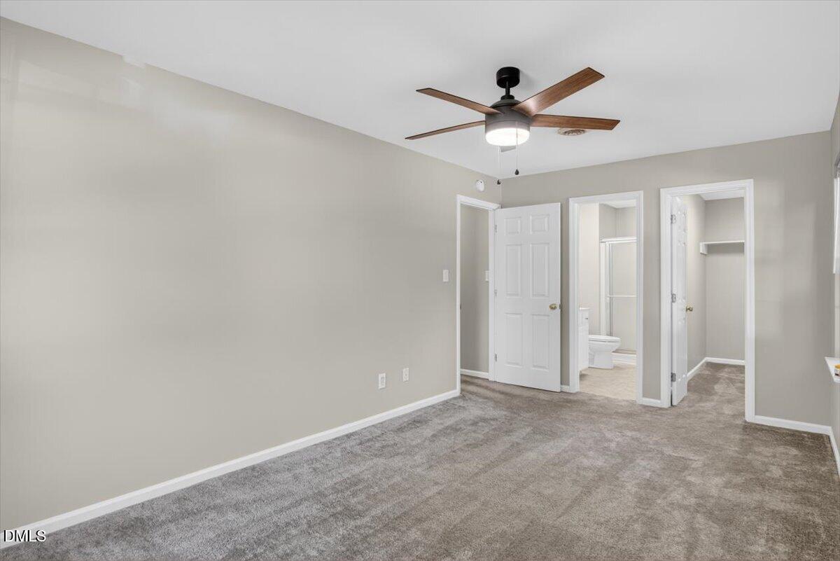 1630 Oxford Road, Unit B Henderson, NC 27536 - Photo 14 of 30 a view of an empty room with a ceiling fan