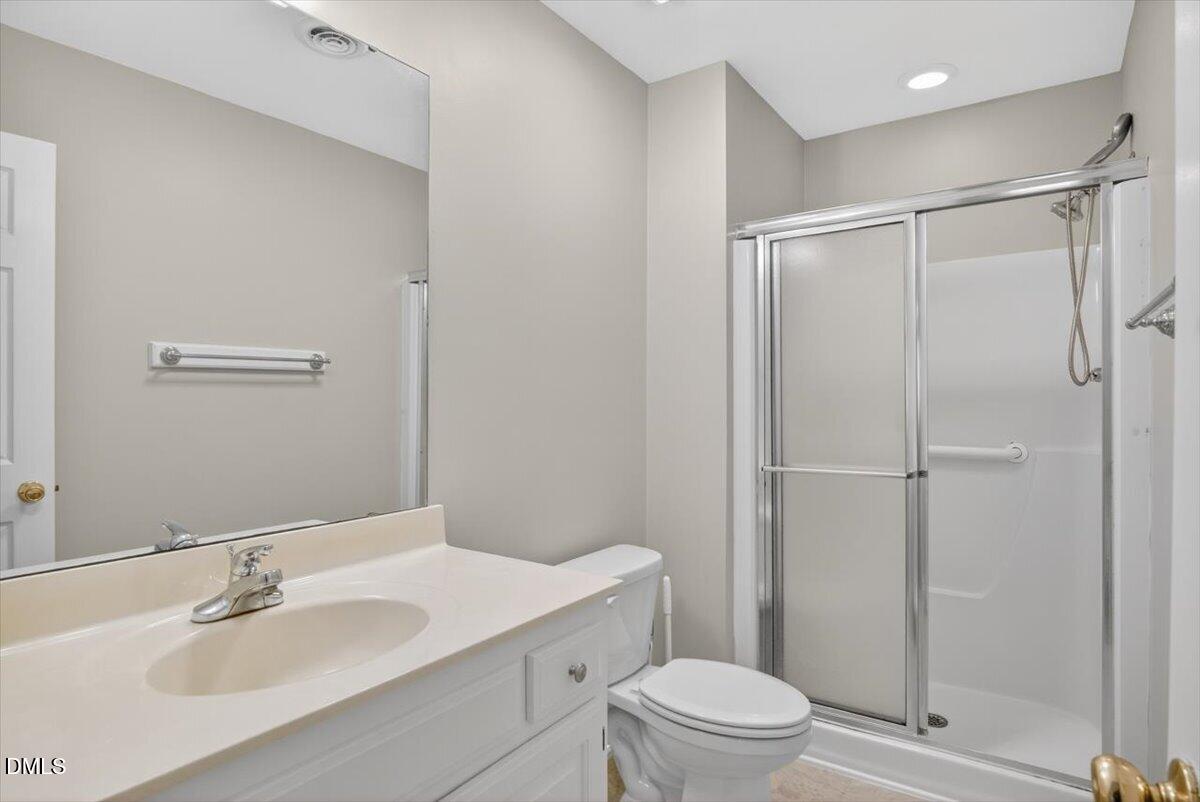 1630 Oxford Road, Unit B Henderson, NC 27536 - Photo 16 of 30 a bathroom with a sink a toilet and shower
