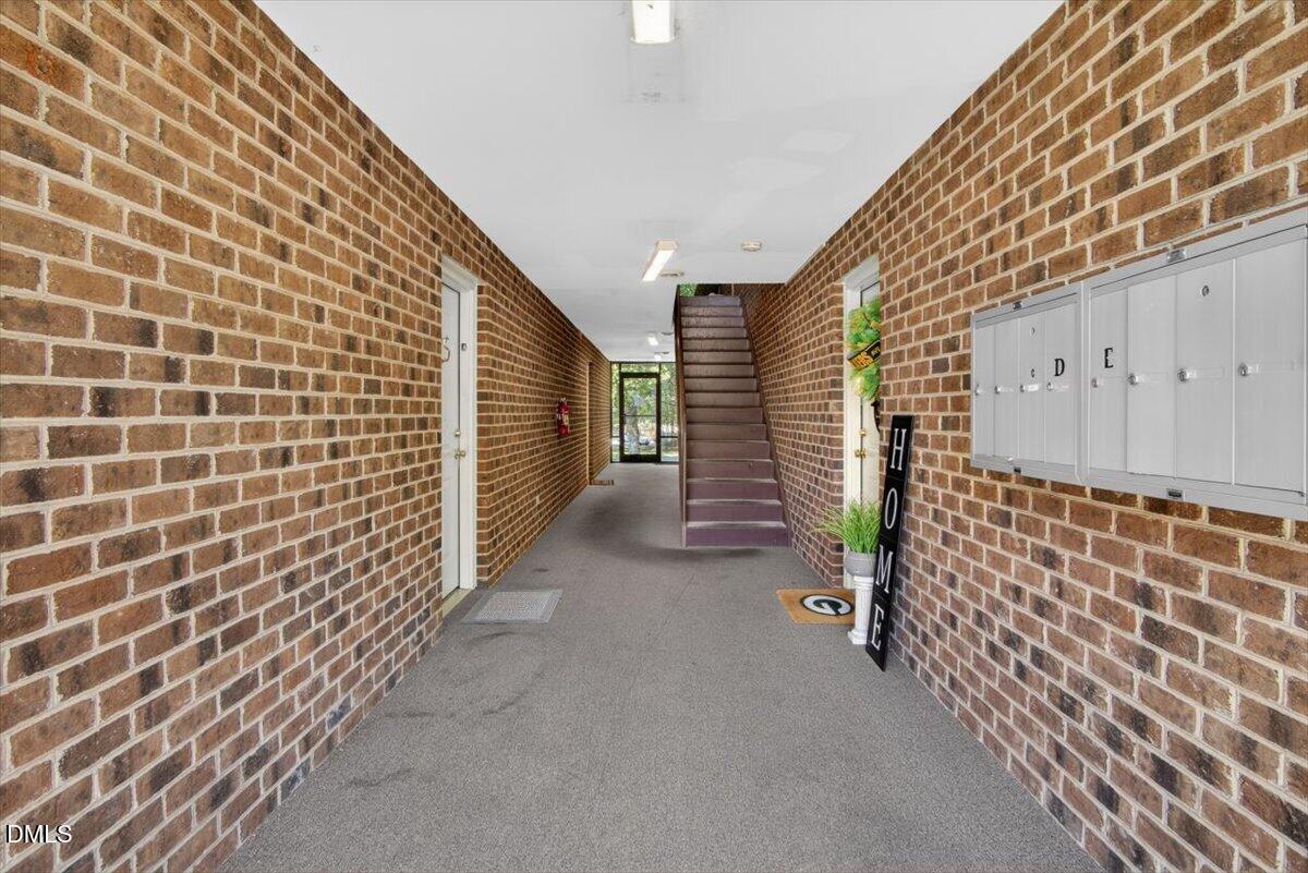 1630 Oxford Road, Unit B Henderson, NC 27536 - Photo 21 of 30 a view of an empty room and wooden stairs