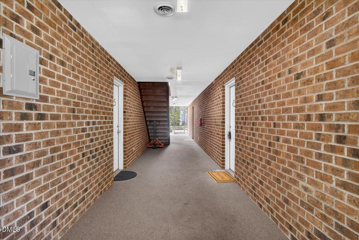 1630 Oxford Road, Unit B Henderson, NC 27536 - Photo 23 of 30 a view of a brick wall with many windows