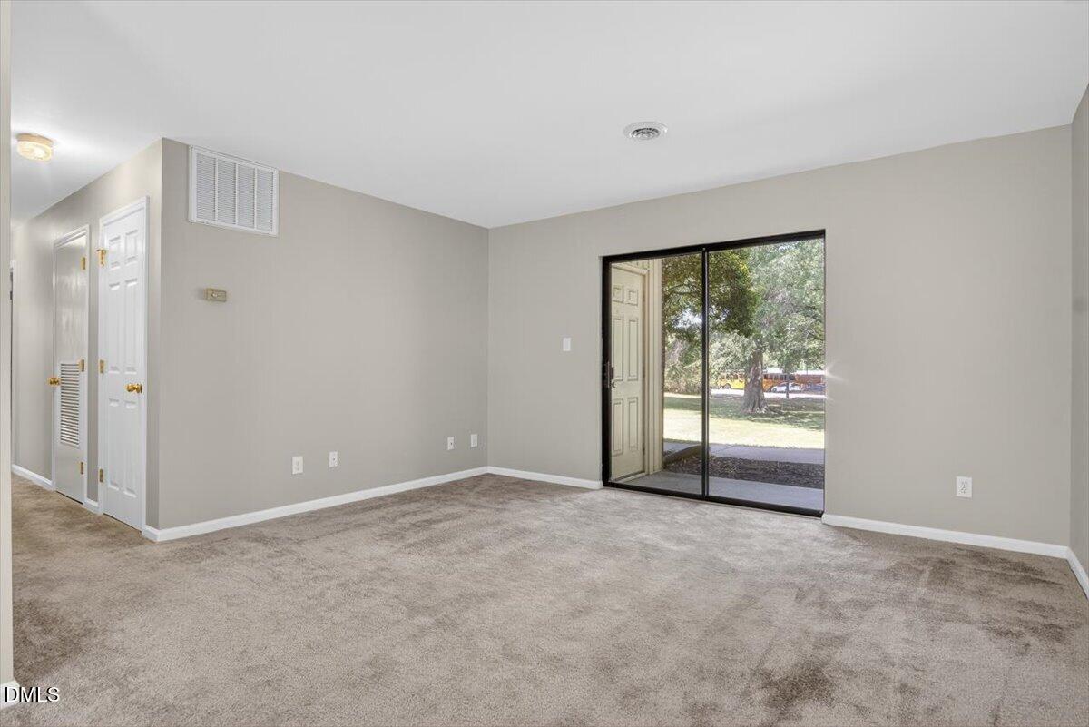 1630 Oxford Road, Unit B Henderson, NC 27536 - Photo 5 of 30 a view of an empty room with a window