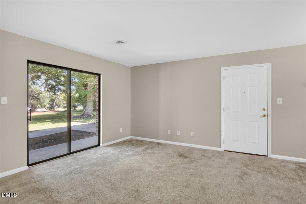 1630 Oxford Road, Unit B Henderson, NC 27536 - Photo 7 of 30 an empty room with windows