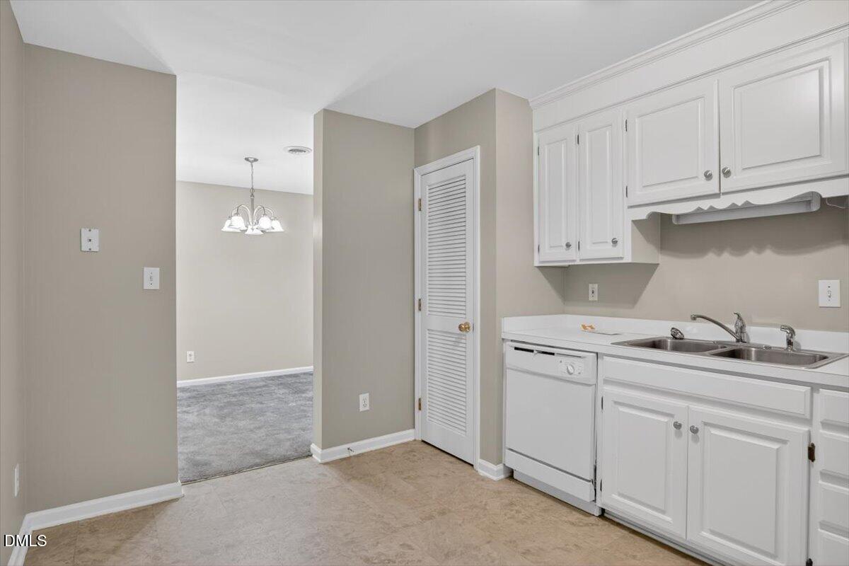 1630 Oxford Road, Unit B Henderson, NC 27536 - Photo 10 of 30 a kitchen with white cabinets and sink