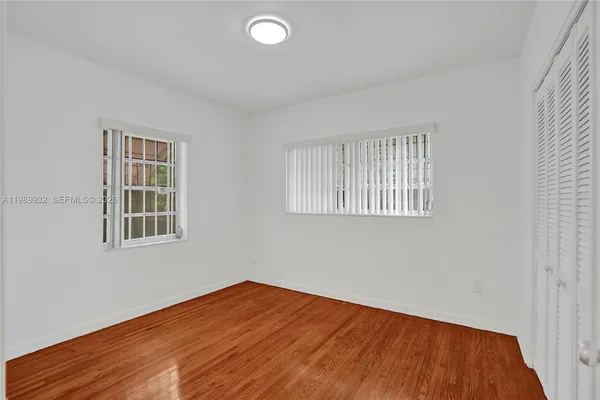a view of an empty room with a couch