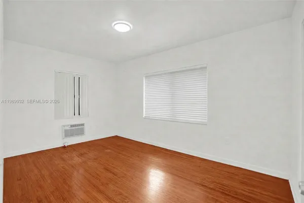 a kitchen with stainless steel appliances granite countertop a stove and a white cabinets