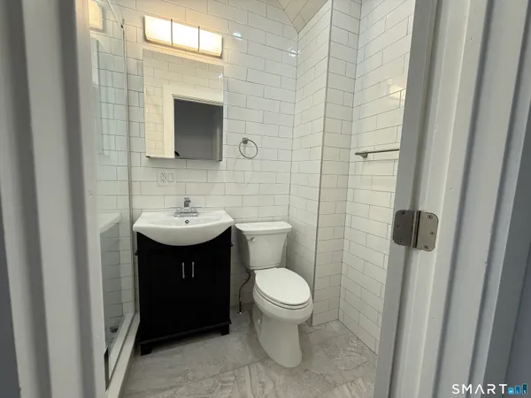 a bathroom with a sink and toilet