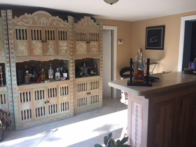 35 Tortuga Road Palm Springs, FL 33461 - Photo 8 of 17 a view of a room with wooden floor and windows