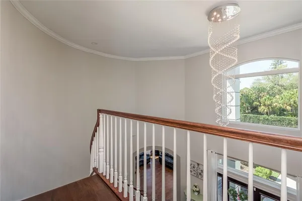 a bedroom with furniture and wooden floor