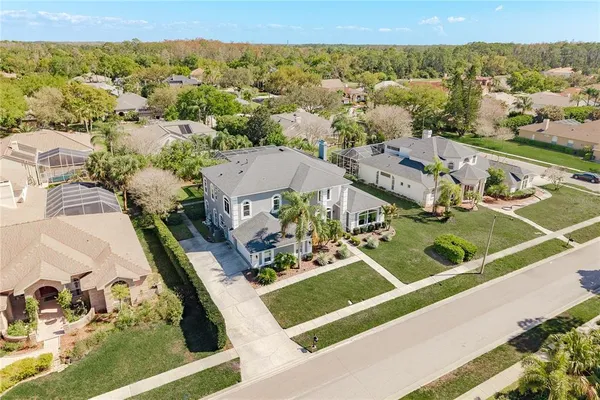an aerial view of residential houses with outdoor space