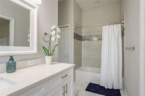 a view of a dining room with furniture large windows and wooden floor