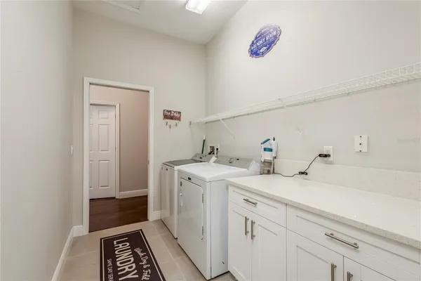 a dining room with furniture and a window
