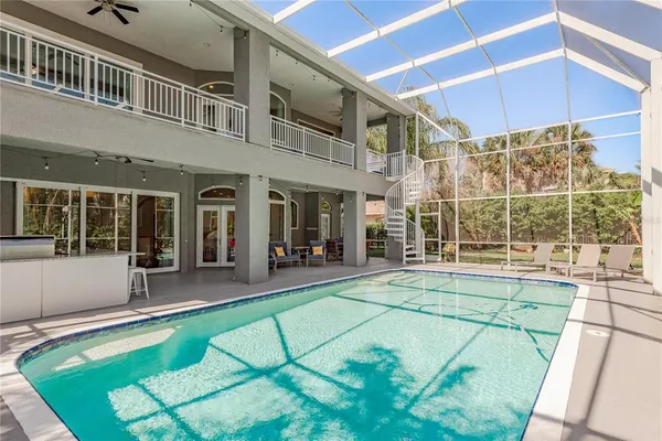 a view of a house with a yard and sitting area