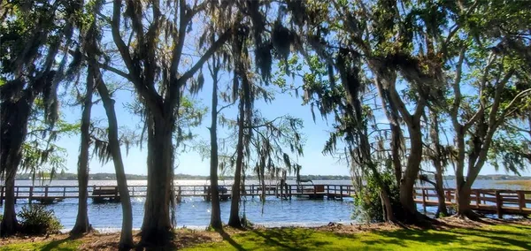 a view of a lake with houses in the back
