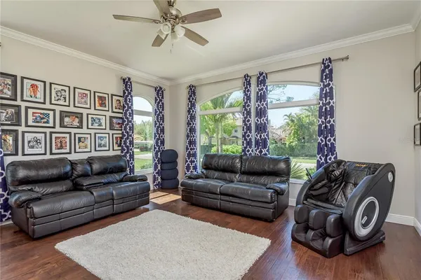 a view of a dining room with furniture and wooden floor
