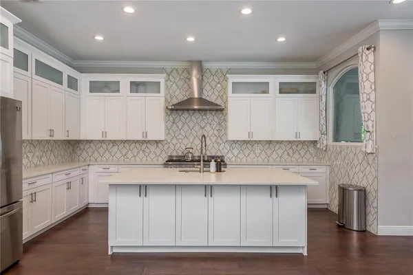 a dining room with furniture and wooden floor