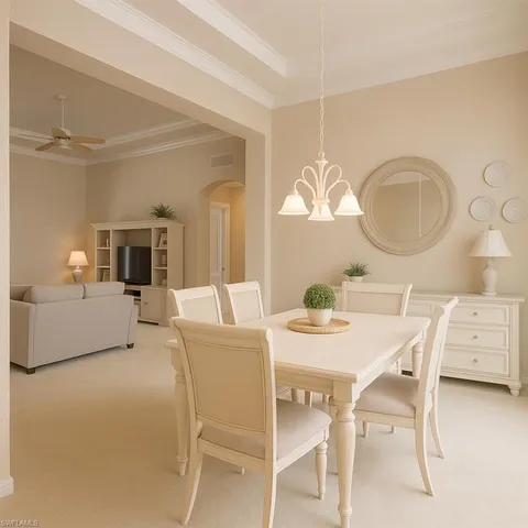 a view of a dining room with furniture and window