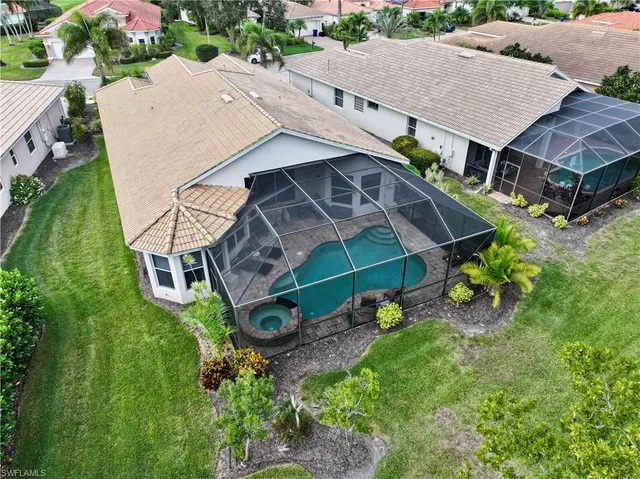 an aerial view of a house with a yard