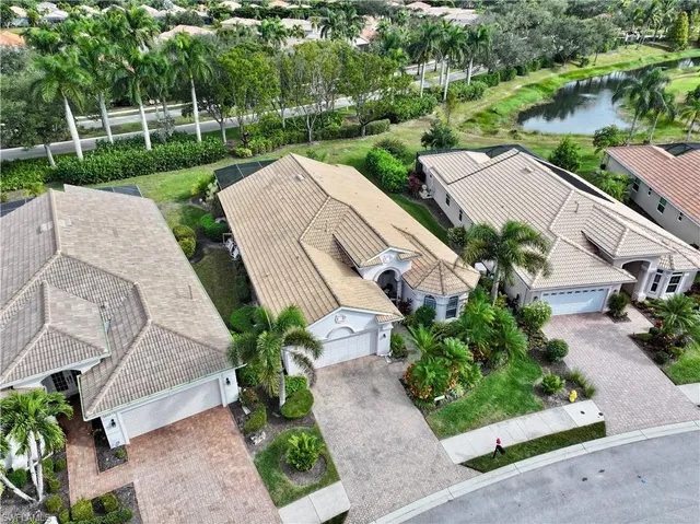 an aerial view of a house with a garden and plants