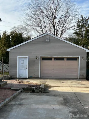 a house that has a tree in front of it