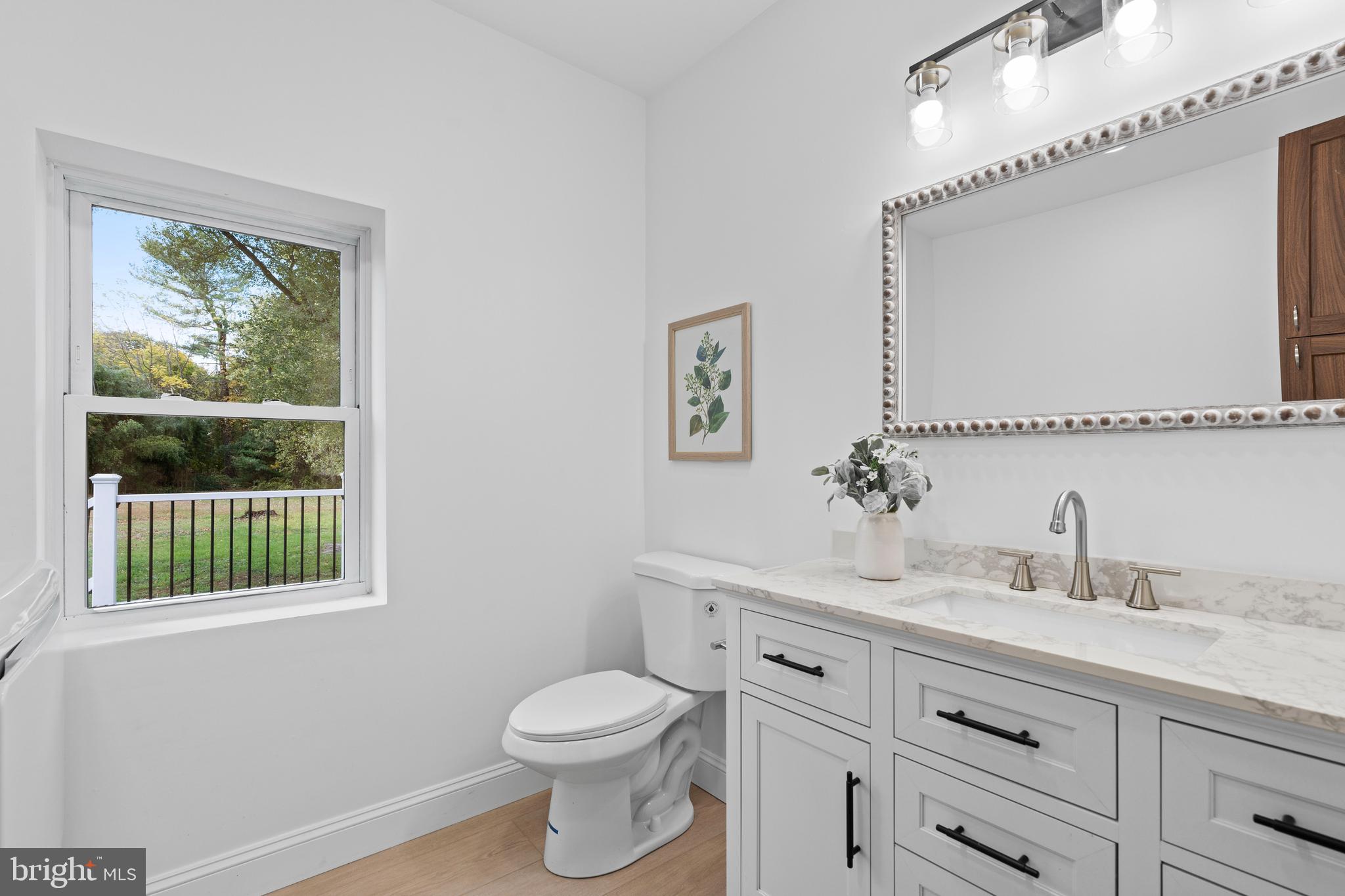 924 Bethlehem Pike Colmar, PA 18915 - Photo 11 of 47 a bathroom with a toilet sink and window