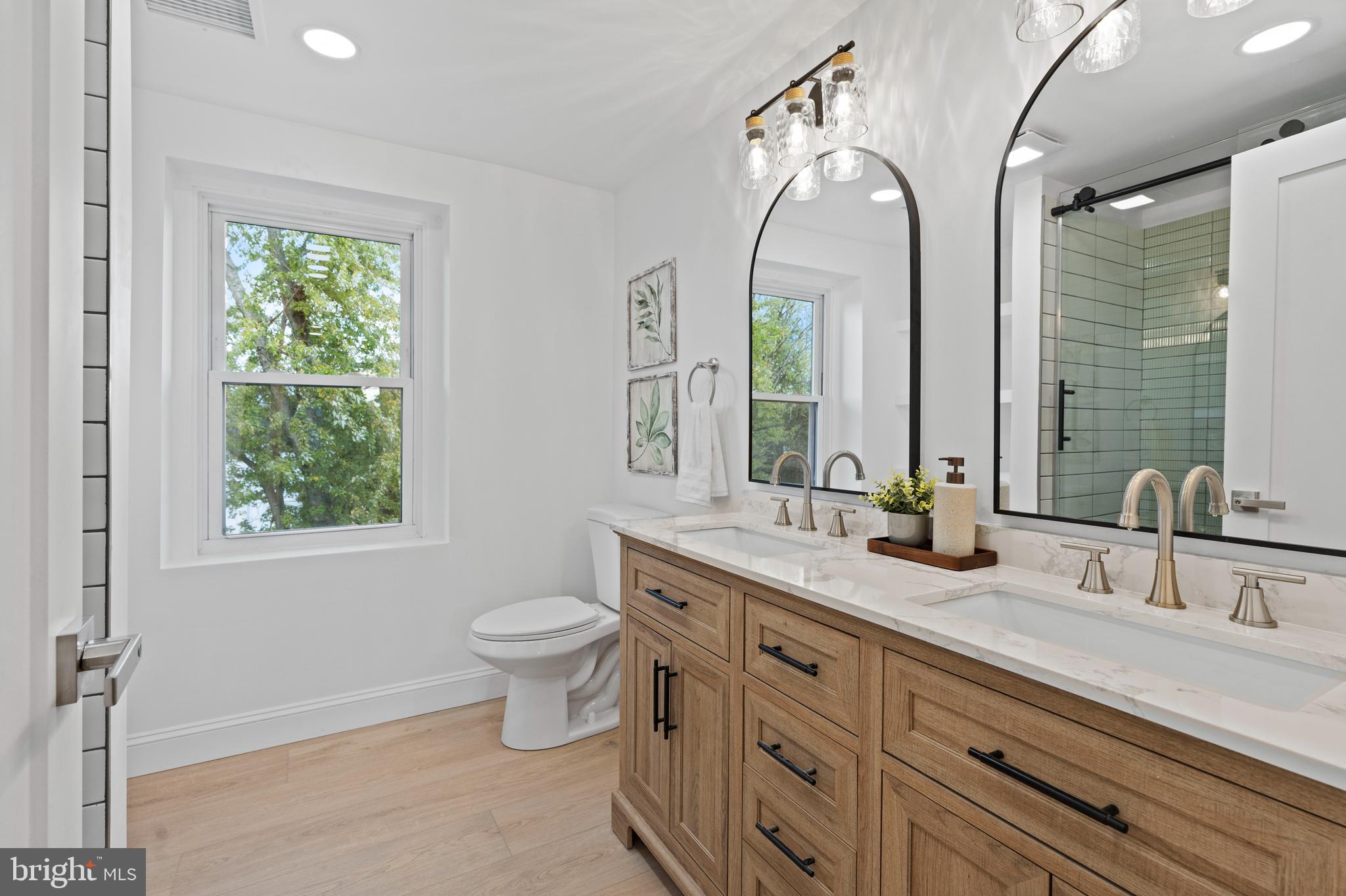 924 Bethlehem Pike Colmar, PA 18915 - Photo 28 of 47 a bathroom with 2 sink and a mirror