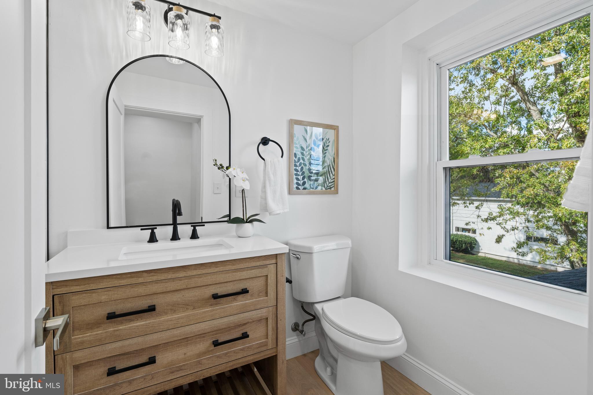 924 Bethlehem Pike Colmar, PA 18915 - Photo 30 of 47 a bathroom with a toilet sink and mirror