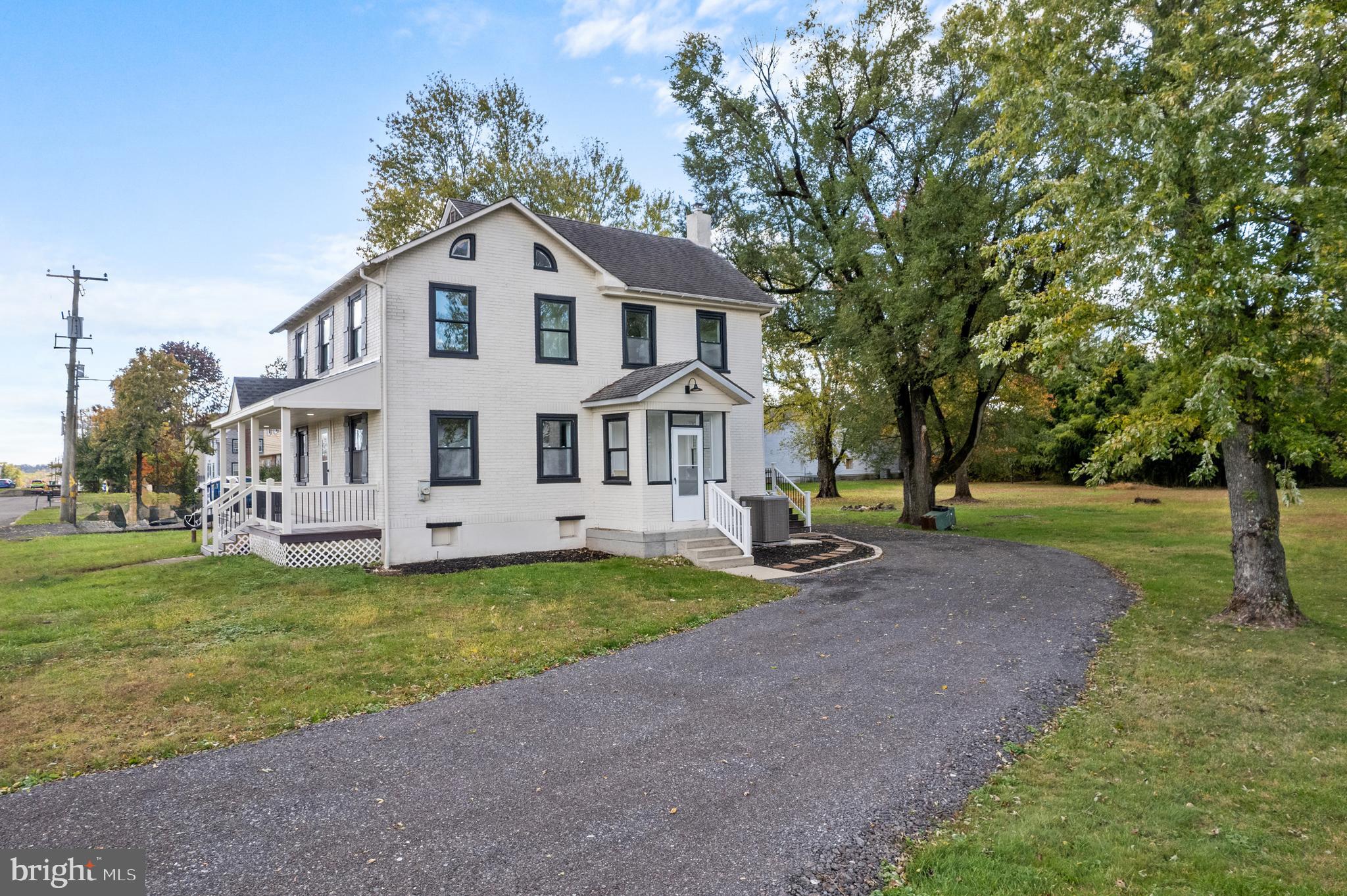 924 Bethlehem Pike Colmar, PA 18915 - Photo 36 of 47 a front view of a house with a garden and trees