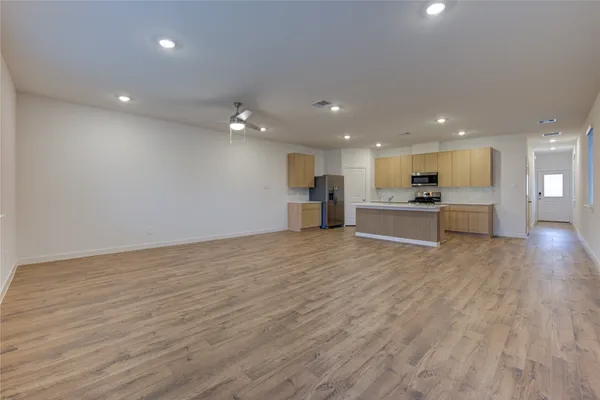 a view of a kitchen with a sink and a stove