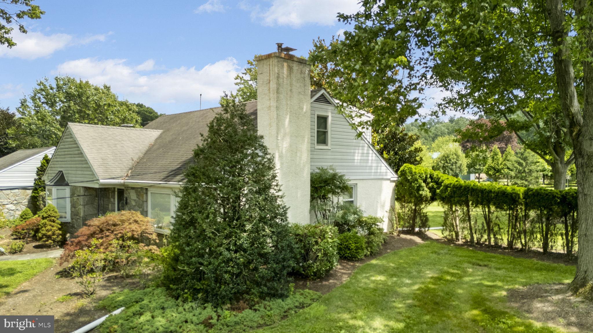 220 Old State Road Berwyn, PA 19312 - Photo 18 of 36 a front view of a house with a garden