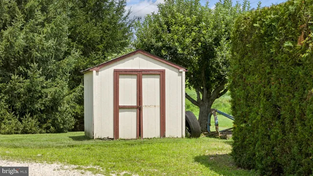 a view of a house with backyard porch and sitting area