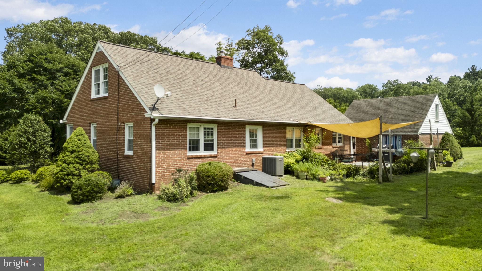 220 Old State Road Berwyn, PA 19312 - Photo 32 of 36 a view of house with yard and green space