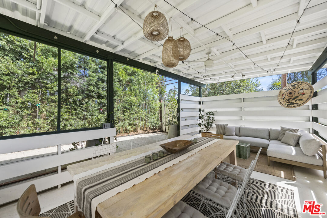 a view of a patio with a table and chairs
