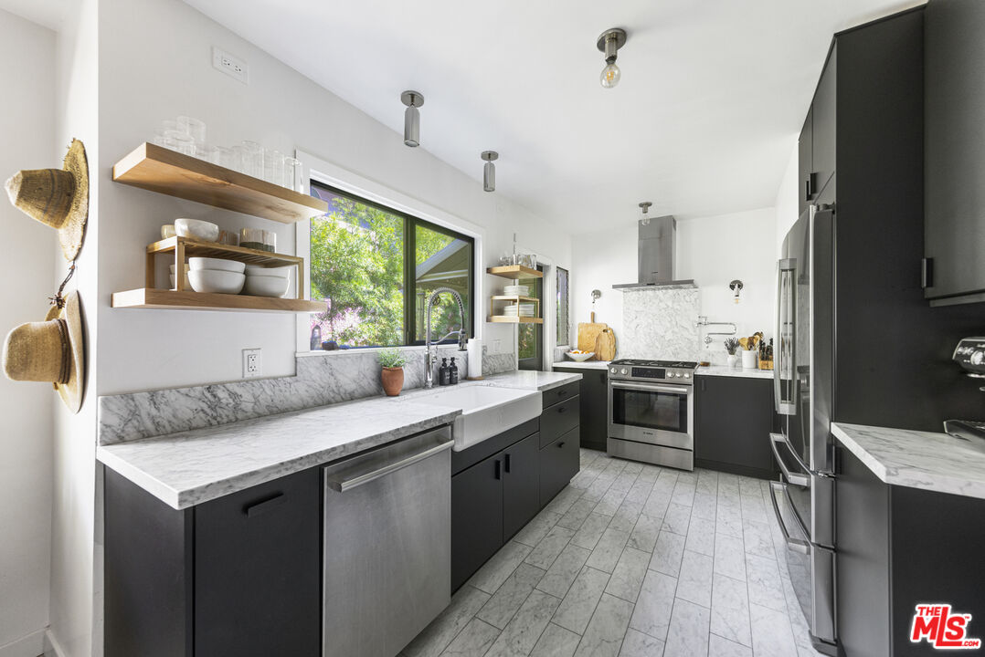 246 Robinson Road Pasadena, CA 91104 - Photo 12 of 43 a kitchen with a sink stove and refrigerator