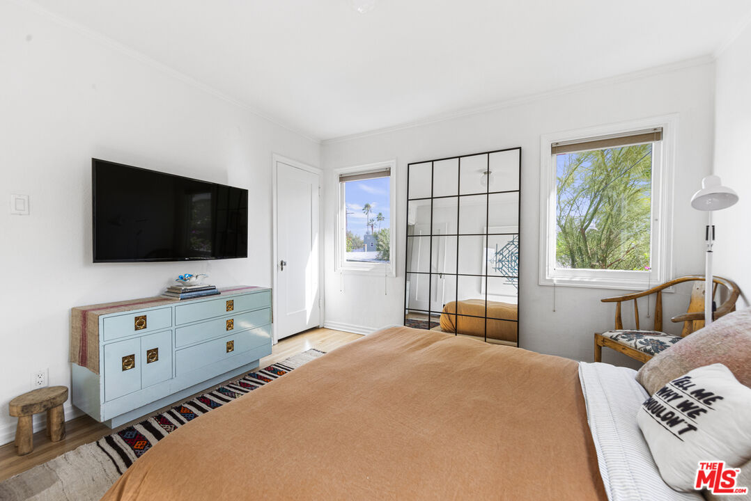 246 Robinson Road Pasadena, CA 91104 - Photo 18 of 43 a bedroom with a bed and a flat tv screen on dresser