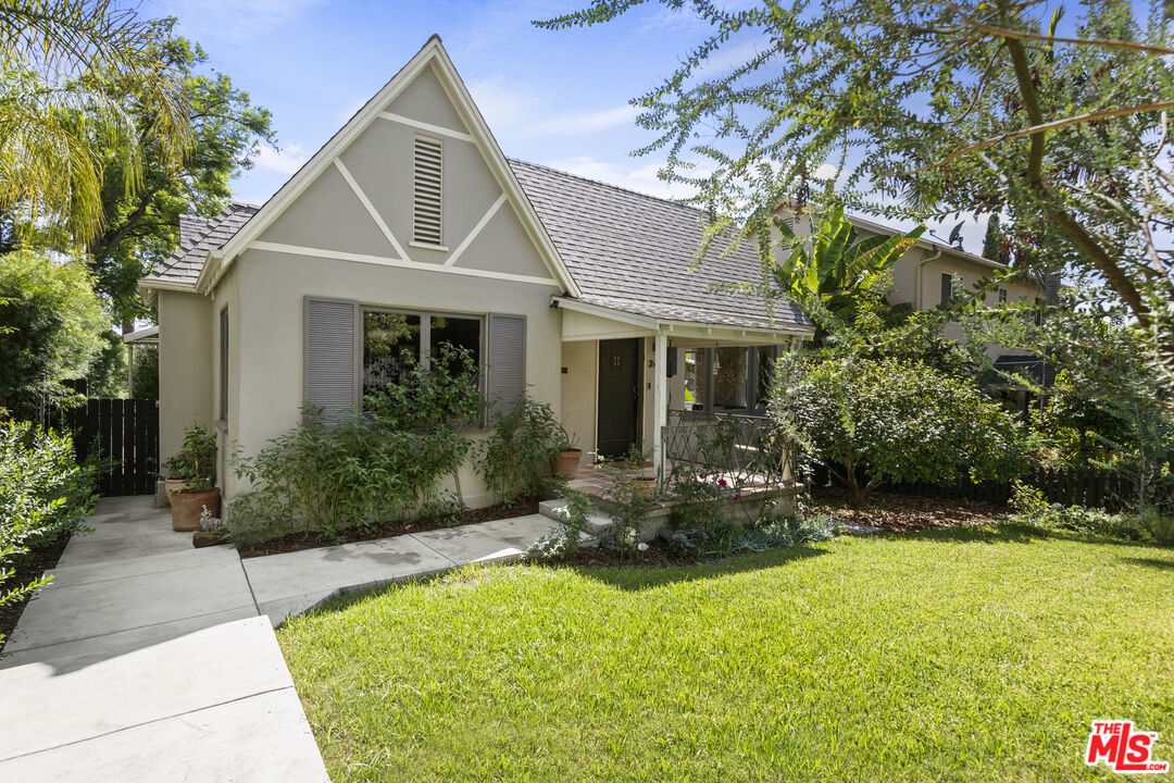 246 Robinson Road Pasadena, CA 91104 - Photo 2 of 43 a front view of a house with a yard