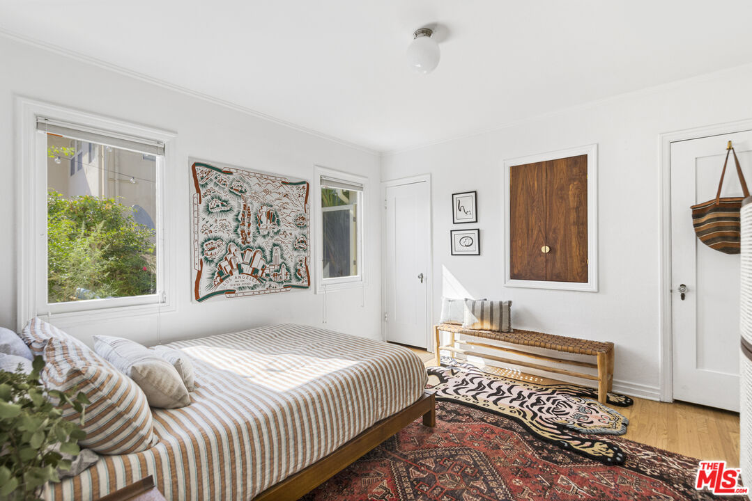 246 Robinson Road Pasadena, CA 91104 - Photo 21 of 43 a bedroom with a bed and a painting on the wall