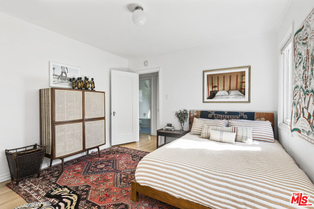 246 Robinson Road Pasadena, CA 91104 - Photo 22 of 43 a bedroom with a bed and a window