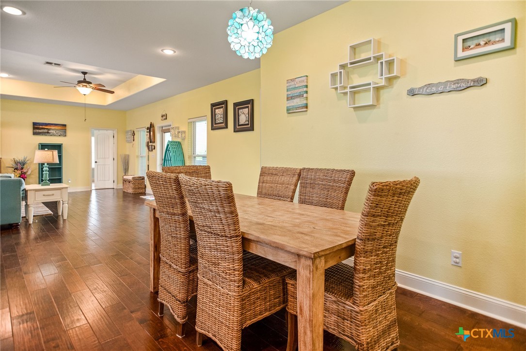 23 Macey Street Port O'Connor, TX 77982 - Photo 25 of 47 a view of a dining room with furniture and wooden floor