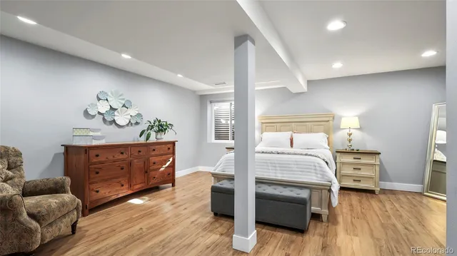 a bedroom with a bed and a dresser