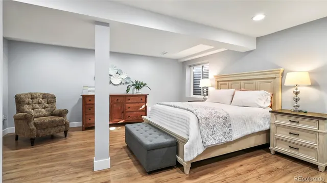 a bedroom with a bed and a couch