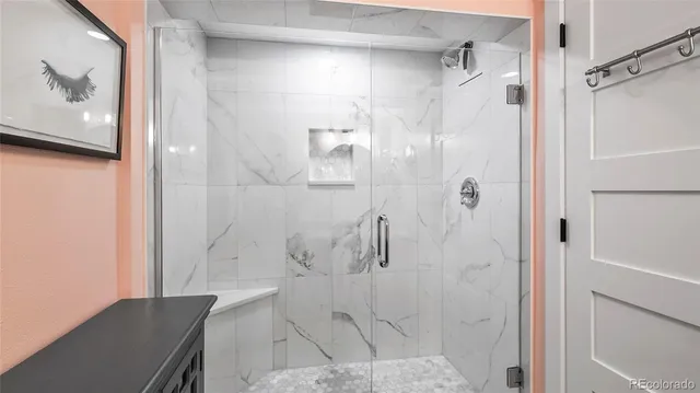 a bathroom with a bathtub and shower