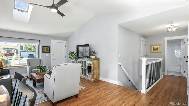 a view of kitchen with furniture and wooden floor