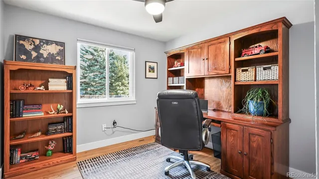 a workspace with furniture and window